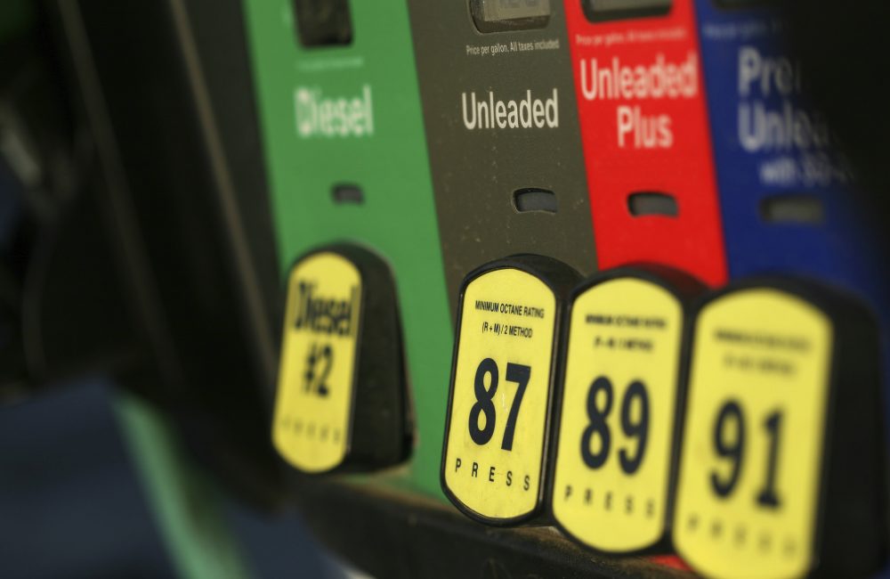 A close-up picture of a gas pump with yellow buttons for diesel and 87, 89, and 91 octane fuel