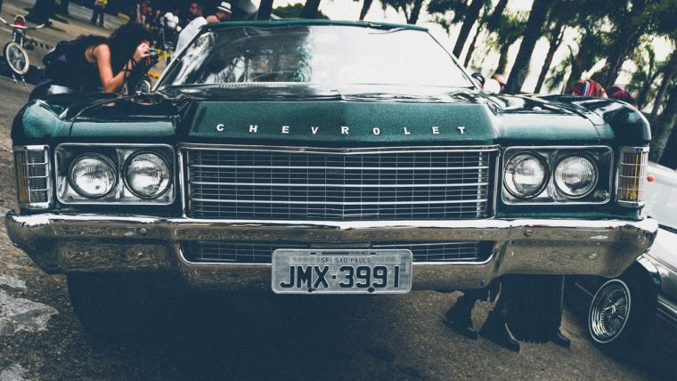 Girl Taking Photo at Car Show