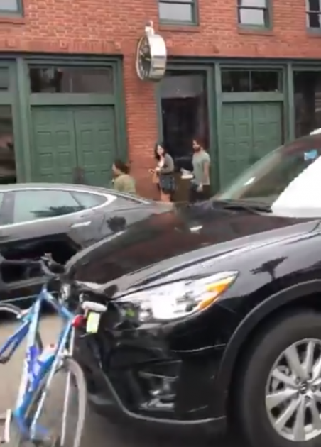 Bicycle in front of stolen Mazda