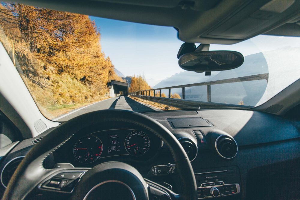 Inside of a car driving along a mountain road