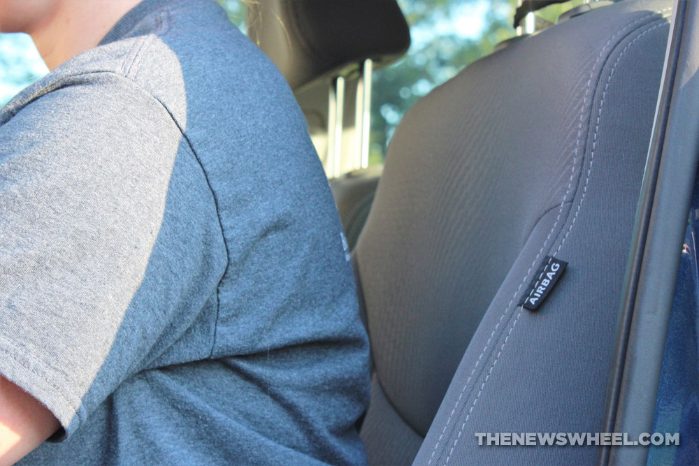 driver leaning forward in car with slouching spine position