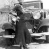 Bonnie Parker in front of a Ford V8