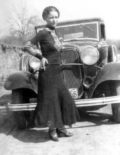 Bonnie Parker in front of a Ford V8