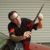 man changing windshield wipers inspection