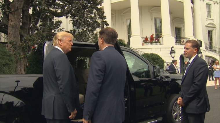 Big Baby Boy Donald Trump Looking at a Ford F-150