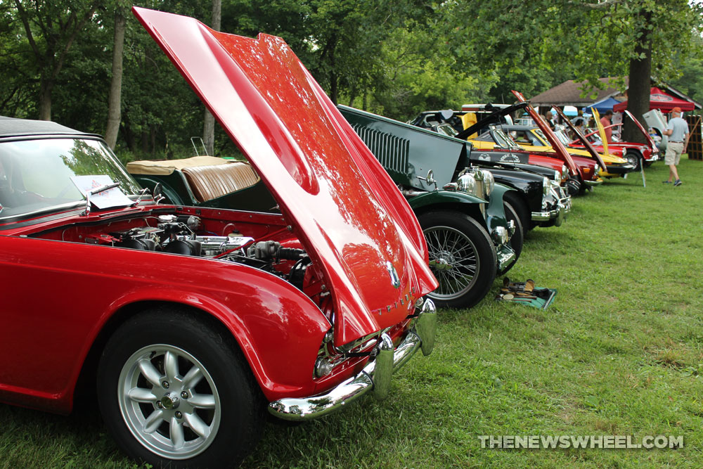 Vintage cars on display cruise in British vehicle show outdoors