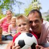 family at a picnic with soccer ball