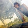 woman checking car engine