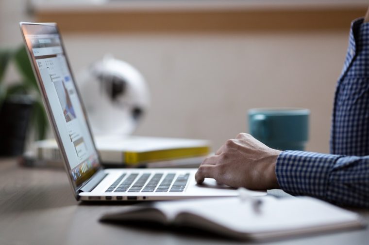 person using laptop computer