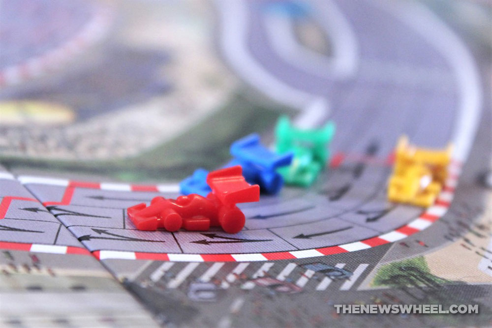 Close-up of car tokens in Formula De motor racing board game