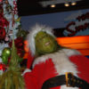 The Grinch Laughing by Christmas Tree