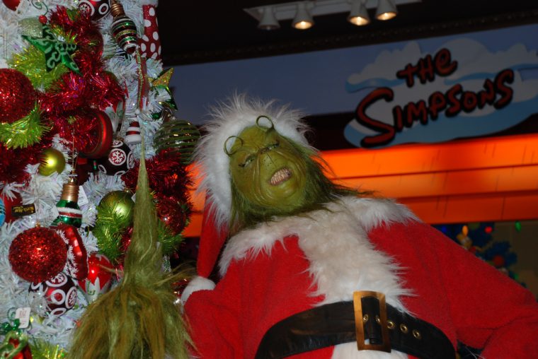 The Grinch Laughing by Christmas Tree