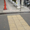 Seiichi Miyake Tenji bricks bumpy pavement tiles in japan crosswalk intersection