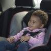 smiling kid in car seat