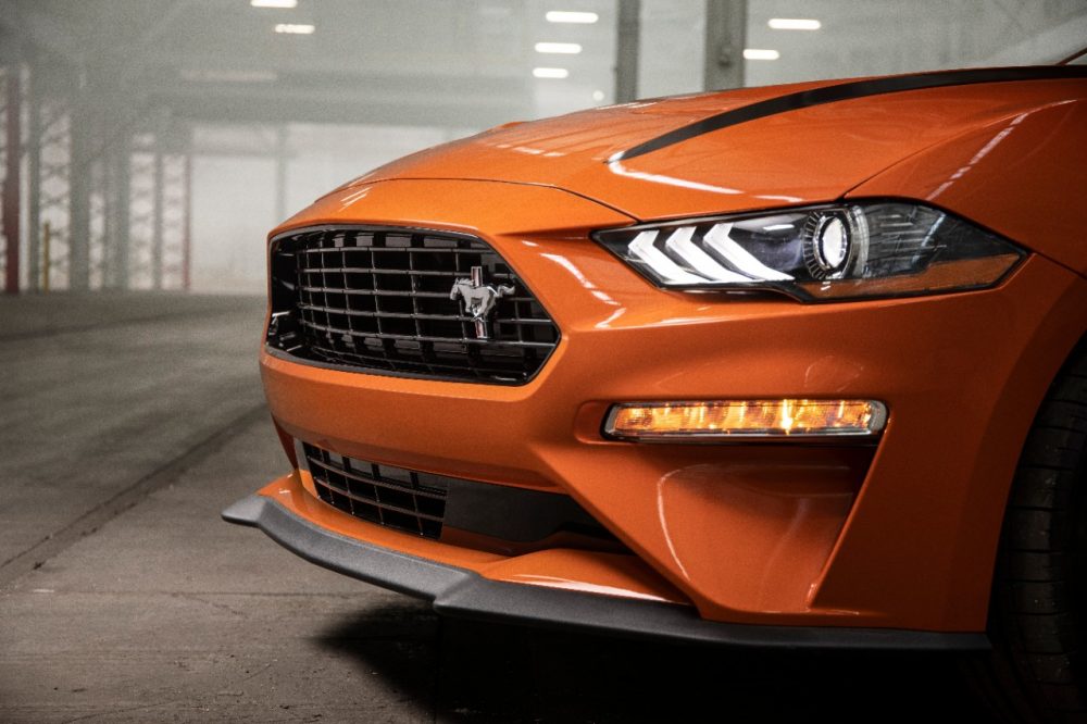 The nose of a Twister Orange Ford Mustang GT