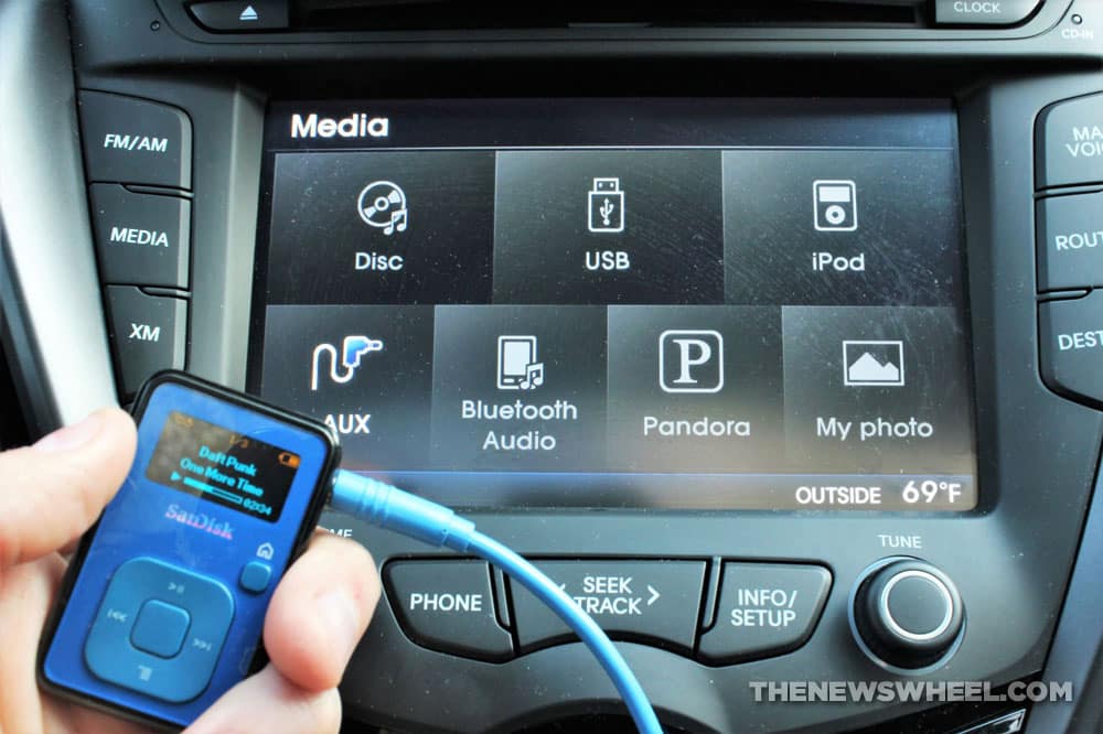 Audio MP3 device plugged into sound system in car