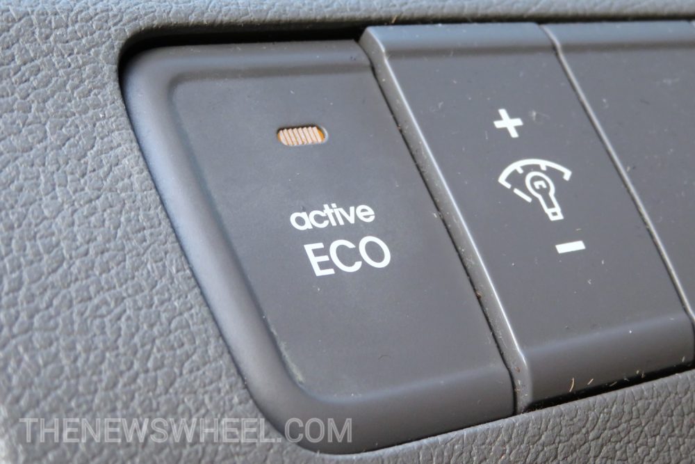 Chances are that if your car as an Eco button, you activate it when you’re driving at low speeds or stop-and-go traffic to conserve fuel. You know that the setting helps your car burn less gas, but do you know what your car’s Eco Mode actually does to its mechanical systems when activated? LINK You can find this function on many sedans and SUVs from Hyundai, Chevrolet, Ford, Kia, Honda, Toyota and even some luxury automakers. Most of the time it’s called Eco, but you also may know it as Econ mode or Active Eco mode. The “Eco” name has two meanings: 1) economical, meaning it’s less costly on your wallet by saving gas, and 2) ecological, meaning the reduced emissions are better for the environment. It changes gearshift mapping to reduce the available torque and dull the throttle response. What does that mean? Activating Eco mode by pressing a button alters the following in your car’s performance: • Adjusts throttle mapping to reduces response: In laymen’s terms, that means your car won’t react as enthusiastically when you press the accelerator pedal. Instead, it’s as if you were only lightly tapping it. • Moves the gear shift points earlier: The transmission remaps to upshift earlier and keep the engine at lower RPMs to ease motor strain. Eco mode can also limit downshifting. • Increases application of engine start/stop: Some Eco systems automatically increase the number of starts and stops to reduce engine labor even more. • Reduce AWD response: Your car’s drivetrain will favor the front wheels most and send less power to the rear wheels if it has an all-wheel drive system. • Diminishes power drain from other systems: Your car may not blow the air conditioning as forcefully or run the electrical or infotainment systems at their full potential so energy is conserved. Benefits of activating your car’s Eco mode include: • Using less gasoline: Because the engine’s power is capped, it consumes less gasoline, so more of that expensive fossil fuel is left in the tank. • Reducing harmful carbon emissions: Toyota actually proved that burning less gas by using Eco mode on its vehicles did indeed reduce tailpipe CO2 emissions. When should you activate Eco mode in your car? When you don’t need to quickly accelerate. Long stretches on the highway at consistent speeds or leisurely rolling from stoplight to stoplight in metro traffic are the best times. The absolute worst time for Eco mode is when you’re merging onto the highway and trying to reach 70 mph in 10 seconds. You also should avoid Eco mode when your car Does Eco mode actually make a difference? Experts disagree on this. While some auto manufacturers claim a recorded improvement in fuel efficiency, Consumer Reports disagrees. The organization found that drivers may work the vehicle harder to overcome the lag of Eco mode. So, actual difference in fuel economy was seen. J.D. Power went even farther and cautioned that using Eco mode could actually put more wear and strain on the powertrain, as the engine has less fuel and oil to use when it must conversely work harder when its full potential is restricted. The best use of Eco mode is, ultimately, when you as the driver also make a concerted effort to drive more gingerly. Use a light foot on the accelerator and let the vehicle use its momentum to cruise along at low speeds when you activate Eco. In other words, go with the flow of Eco instead of fighting it.