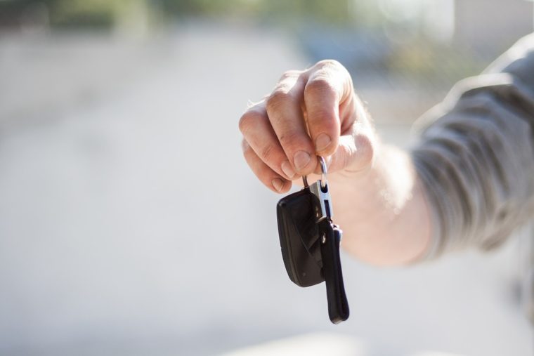 person holding car keys key fob take the keys designated driver