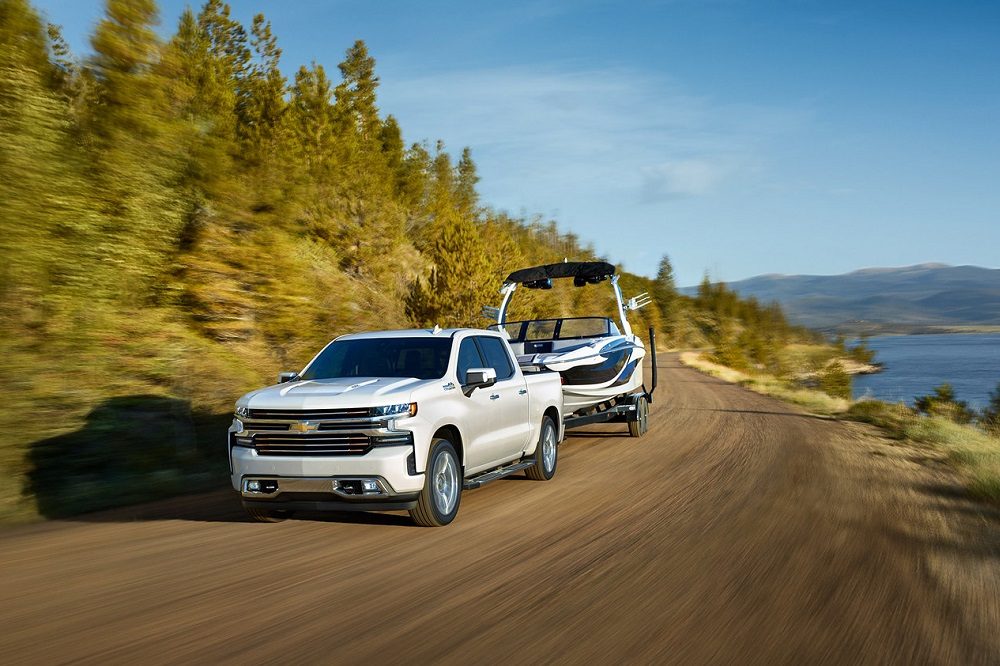 2019 Chevrolet Silverado white towing boat