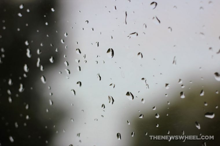 Rain on car window windshield resulting in moisture condensation