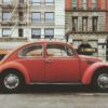 A Red VW Beetle on a city street