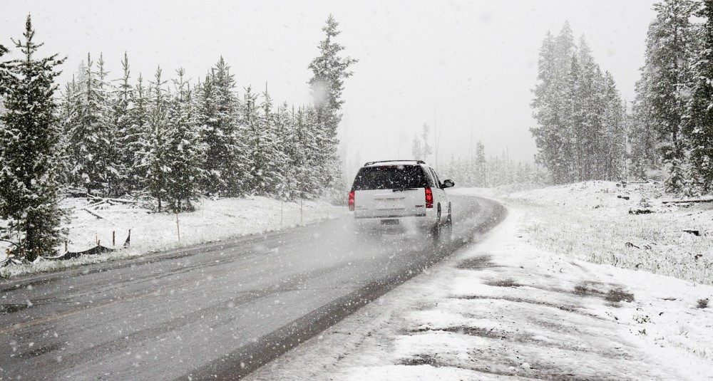 GMC SUV Driving In Snow