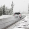 GMC SUV Driving In Snow