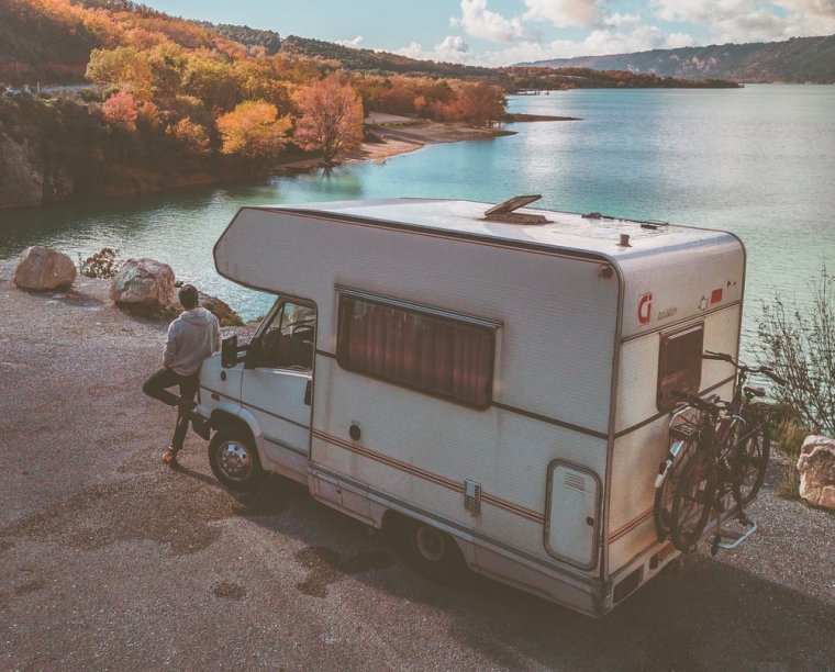 Man leaning on white RV