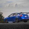 A Blue Subaru STI S209