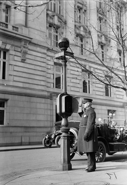 Washington DC Police Officer using a call box in the early 1900s.