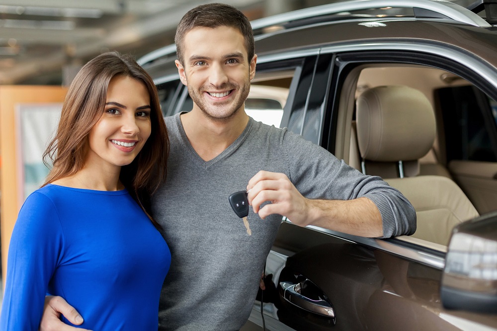 Couple holding car keys