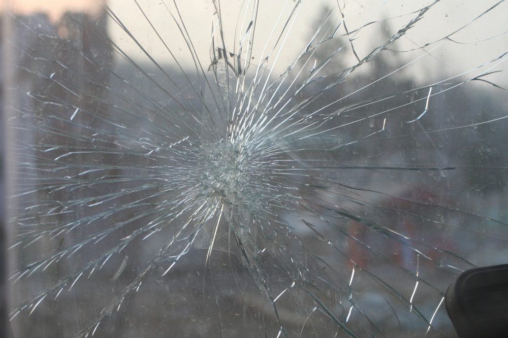 windshield with a large crack in the middle