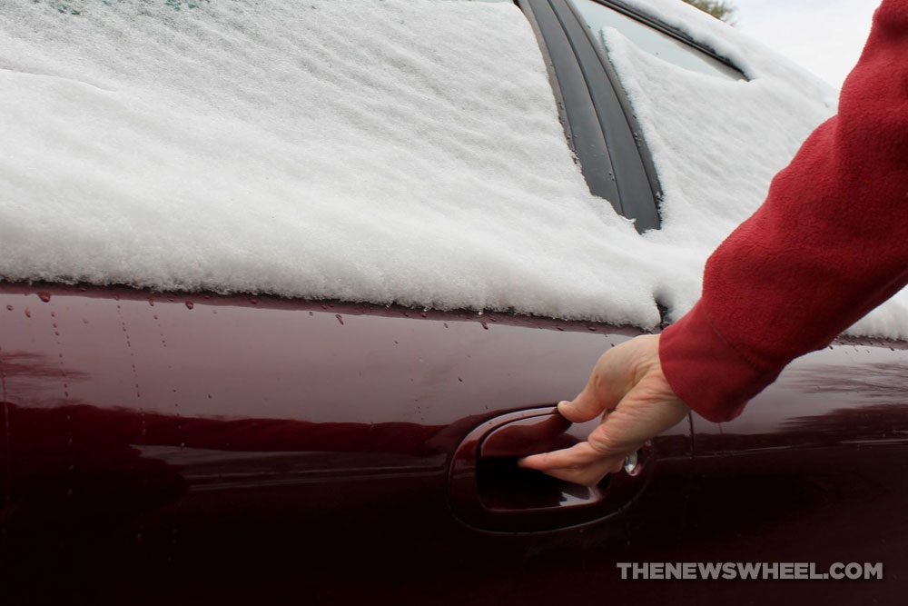 car door frozen shut ice winter handle hand grab