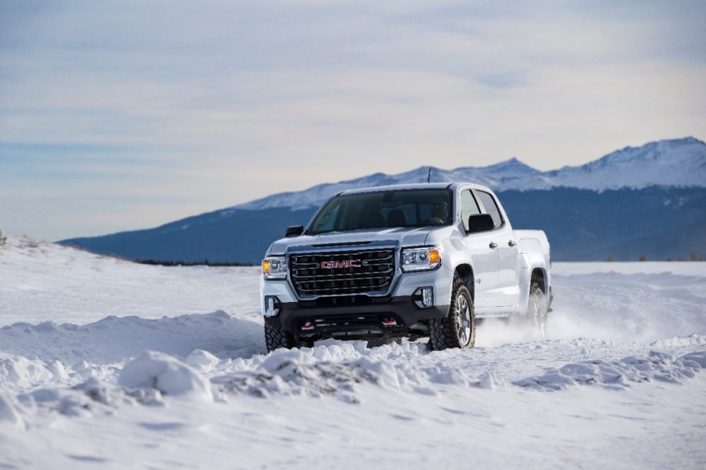 The 2021 GMC Canyon AT4 driving in the snow