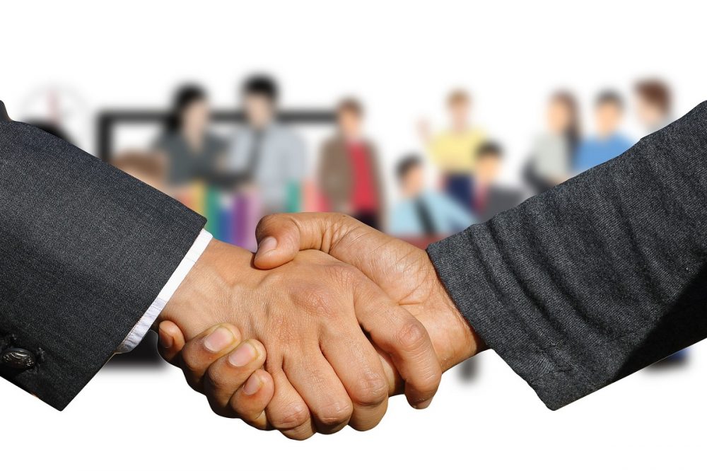 shaking hands meeting partnership