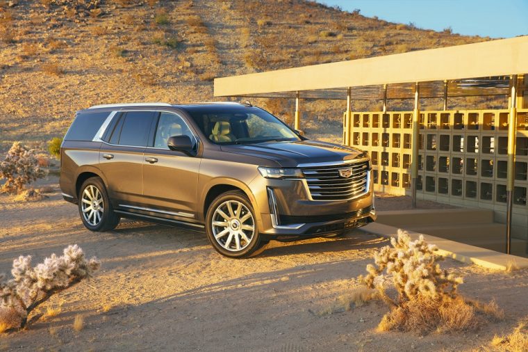 The 2021 Cadillac Escalade by a sandy hill