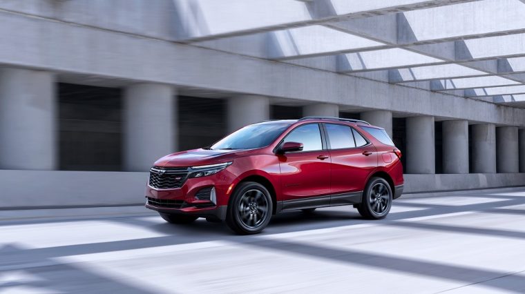 The 2021 Chevrolet Equinox RS driving on the street