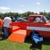 An orange 1962 Chevrolet Corvair Pickup