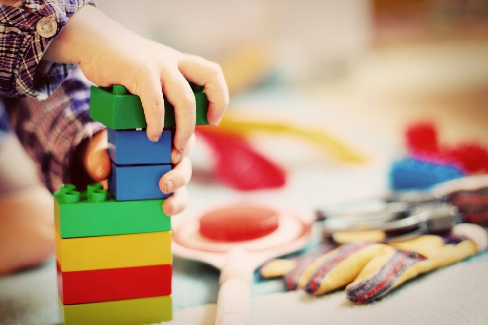 Boy is playing with toys