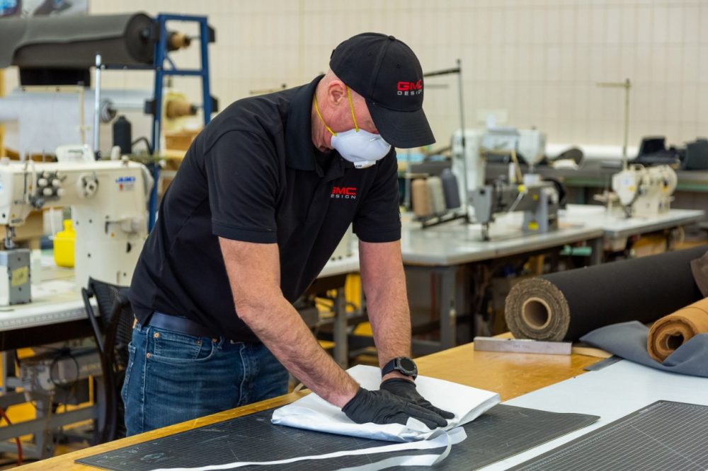 GM employees producing protective gowns. More personal protective equipment