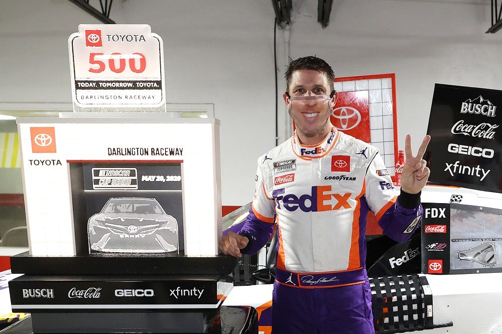 Denny Hamlin celebrates Toyota 500 win in COVID-19 mask