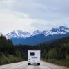 RV Driving Toward Mountains