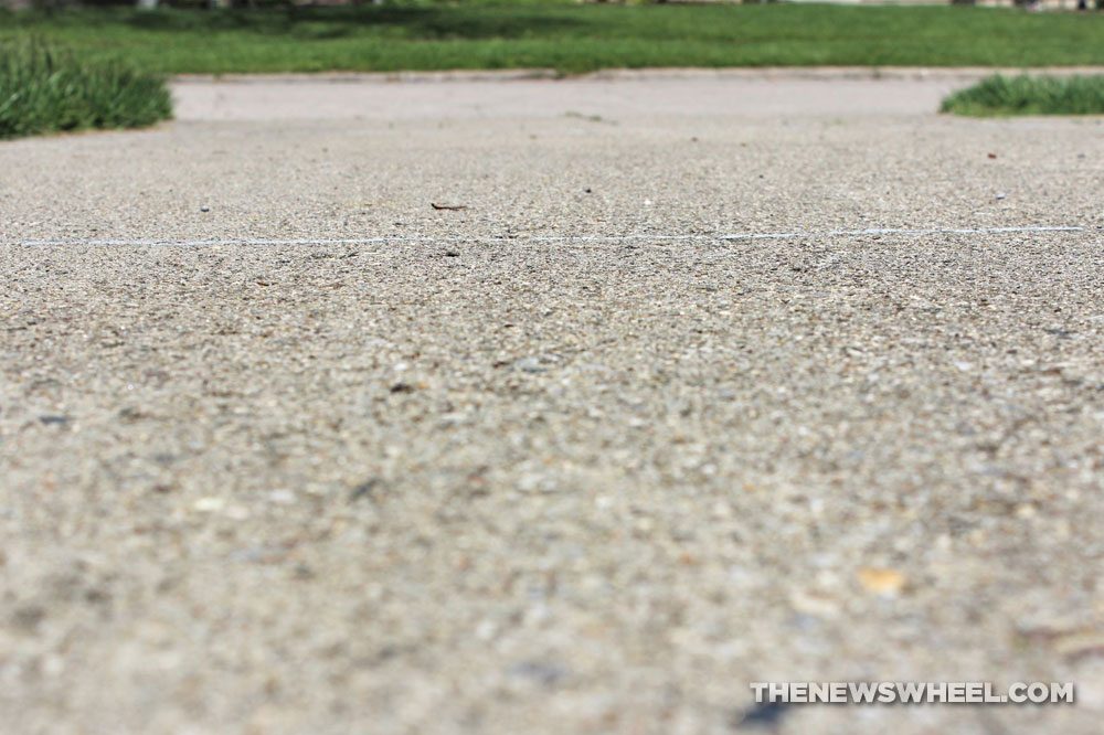 driveway pavement concrete surface cracks stone