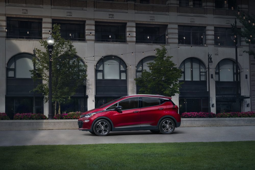 The 2020 Chevrolet Bolt EV in front of a building