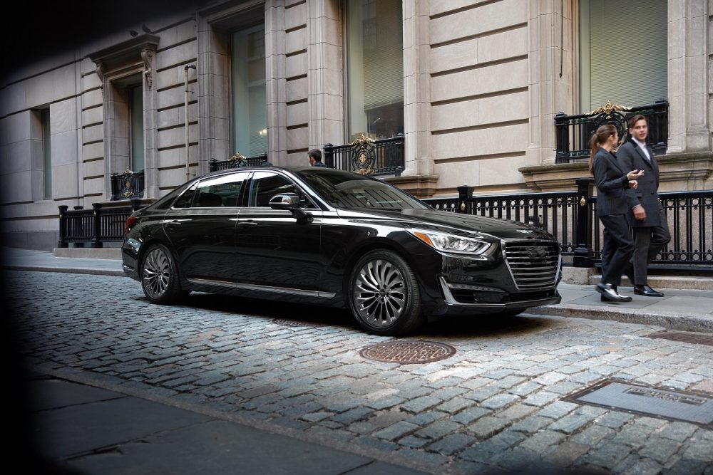 Front side view of 2020 Genesis G90 parked on brick street