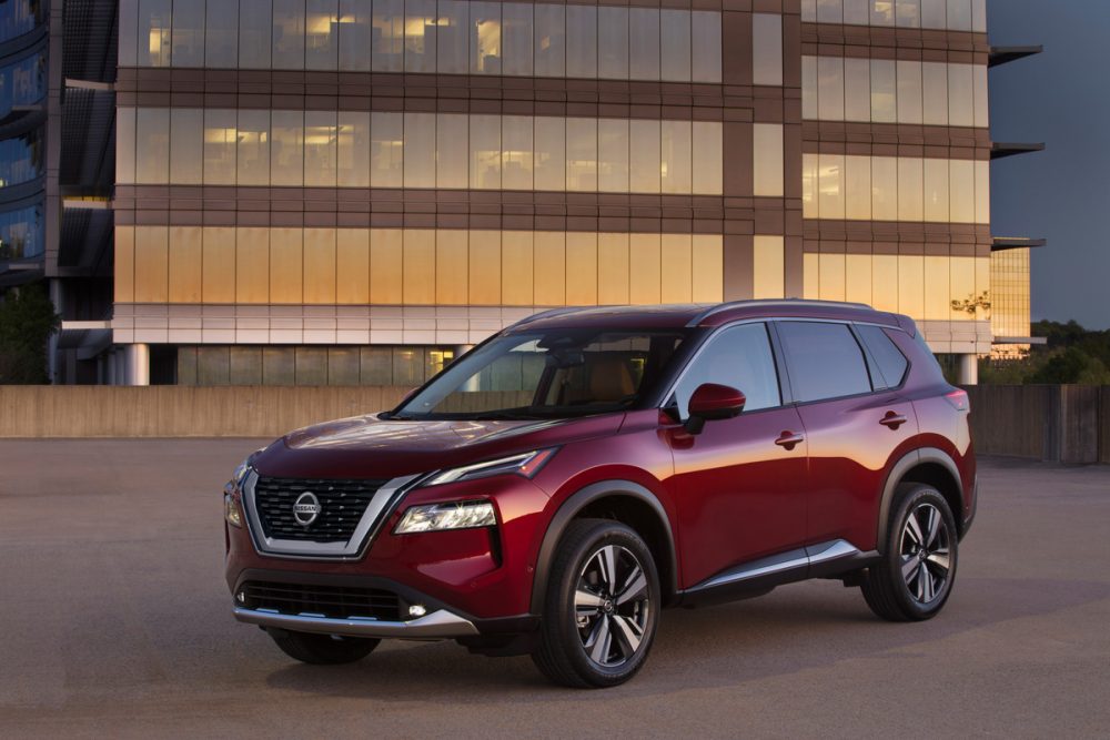2021 Nissan Rogue in front of a large building