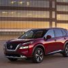 2021 Nissan Rogue in front of a large building