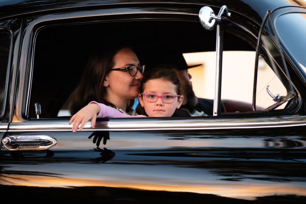 Family driving in a car. Car shopping with your kids. 