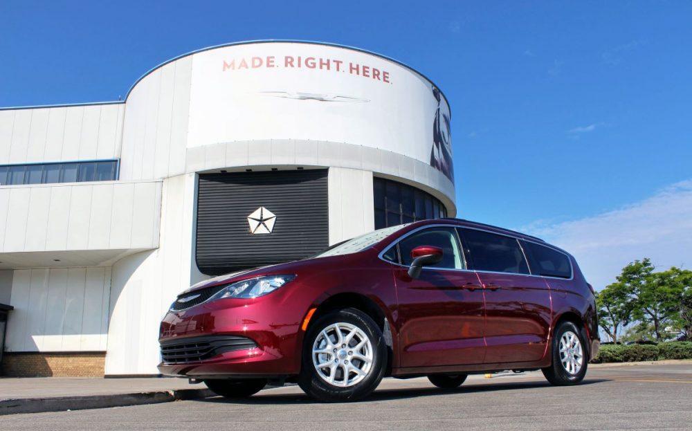 The 2021 Chrysler Grand Caravan in front of its manufacturing plant