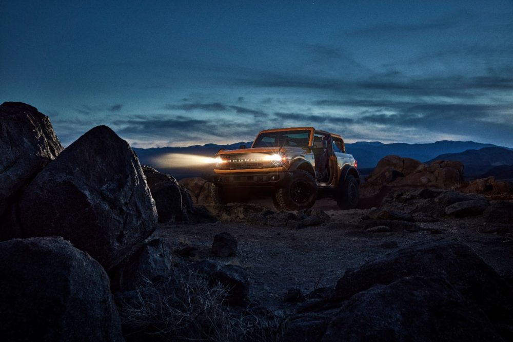 2021 Ford Bronco two-door parked on rocky terrain at night
